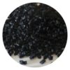 Close-up image of black rubber crumb infill for artificial turf