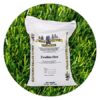 bag of zeolite artificial turf infill positioned in front of green grass